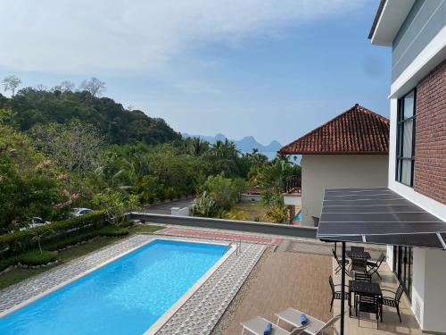 a view of a swimming pool on a house at Casa al Mare Andaman Hills Villa in Pantai Cenang