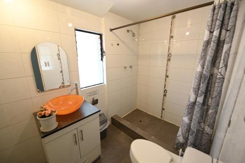 a bathroom with a sink and a toilet and a shower at Cusco Retreat in Cusco