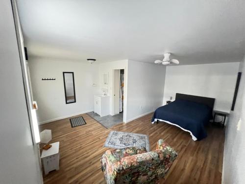 a living room with a bed and a couch at LittleBetty's LandingPad in Torrance