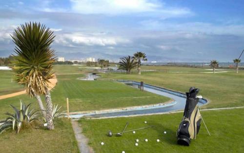 a view of a golf course with a water hazard at La Baraka de Guadalmar B&B Aeropuerto in Málaga