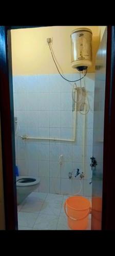 a bathroom with a toilet and a sink at On Hill Rooms in Yercaud