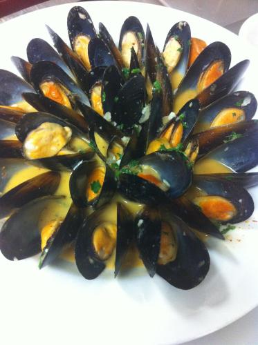 a plate of mussels on a white plate at The Inn at Jim Thorpe in Jim Thorpe
