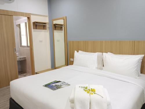 Postel nebo postele na pokoji v ubytování Beyond 21 Hotel