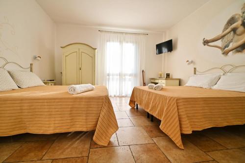 Postel nebo postele na pokoji v ubytování Olimpo B&B