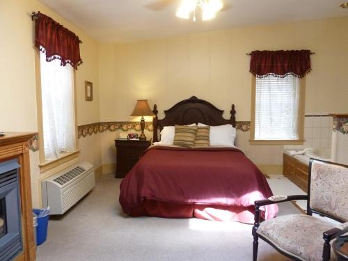 a bedroom with a large bed in a room at The Inn at Jim Thorpe in Jim Thorpe