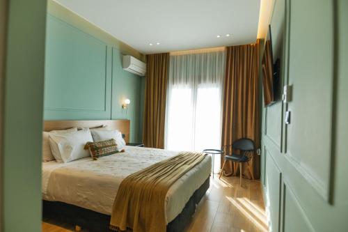 Posteľ alebo postele v izbe v ubytovaní Aggelos Hotel
