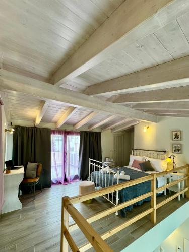 a bedroom with a bed in a room with wooden ceilings at Apidalos Apartments in Corfu