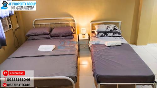 Una cama o camas en una habitación de Mejia Gate 3
