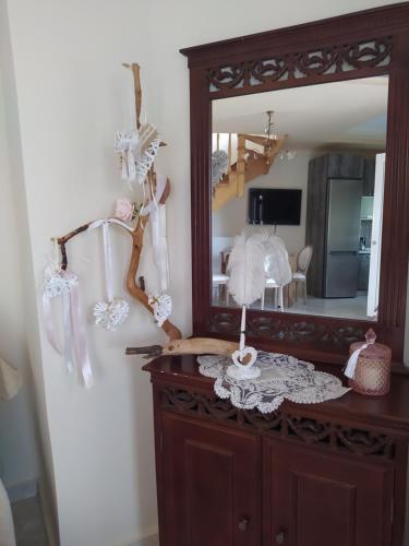 a mirror on top of a dresser in a room at SUN GARDEN in Skala Sotiros