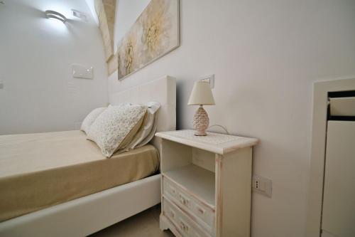 Postel nebo postele na pokoji v ubytování OLIMPO - LA DIMORA DELLE DIVINITA'