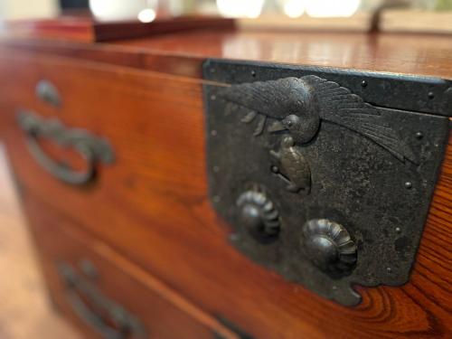 a wooden dresser with a fish carved into it at 游　別邸　飛騨高山　狐福 in Takayama