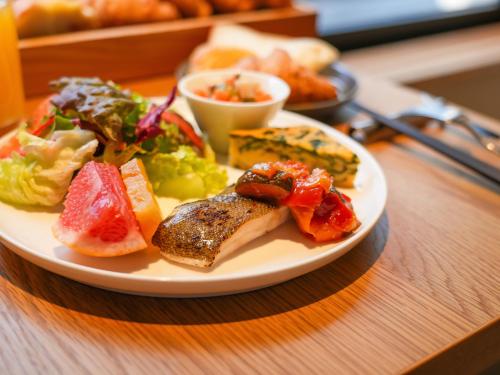 a plate of food on a table with food at THE GENERAL KYOTO Bukkouji Shinmachi in Kyoto