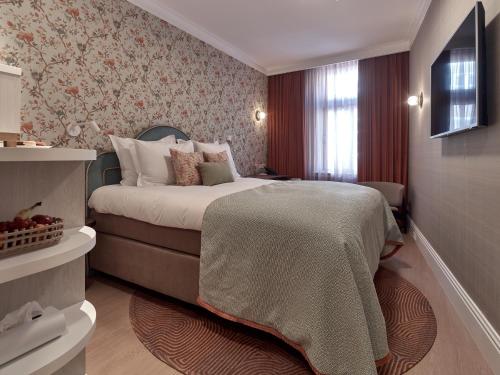 Кровать или кровати в номере Good Seasons Hotel Den Bosch