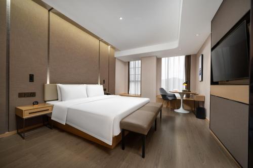 Katil atau katil-katil dalam bilik di Atour Hotel Longgang gankeng Ancien Ttown