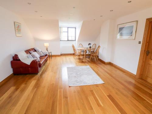 a living room with a couch and a table at Doonalton House in Carrowmably