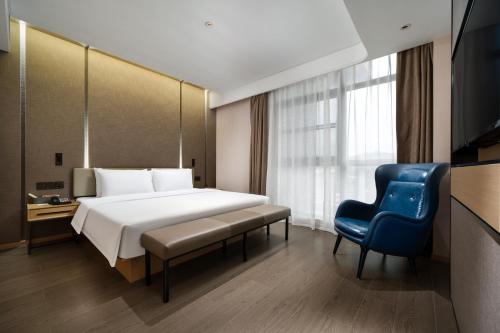 Katil atau katil-katil dalam bilik di Atour Hotel Longgang gankeng Ancien Ttown