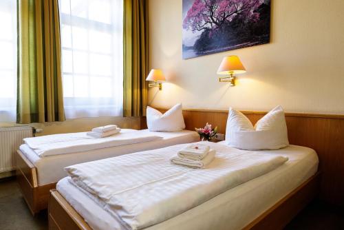 Ένα ή περισσότερα κρεβάτια σε δωμάτιο στο Flair Hotel Kamenz