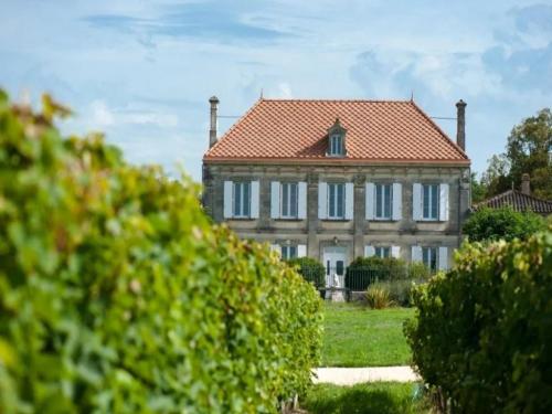 a large house with a red tile roof at Elegant Château Escape in Cézac