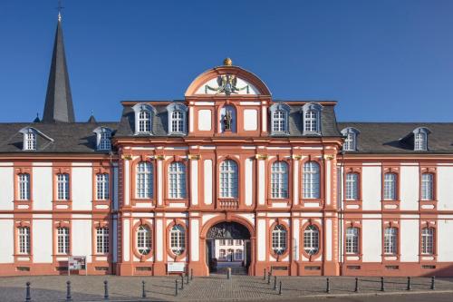 a large building with a clock on top of it at Abtei Hotel in Brauweiler