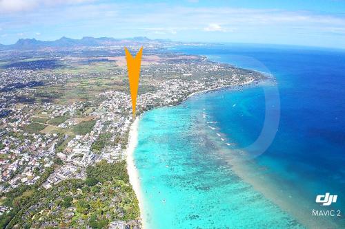 an aerial view of a beach and the ocean at Caro's Beachfront in Trou aux Biches