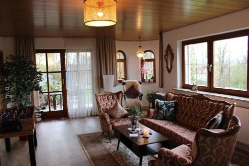 a living room with a couch and a table at ZumGlückFrei in Passau