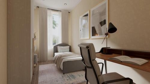 een slaapkamer met een bureau, een bed, een bureau en een stoel bij BW5 - Luxurious three bedroom apartment - 110qm - AC in Mülheim an der Ruhr