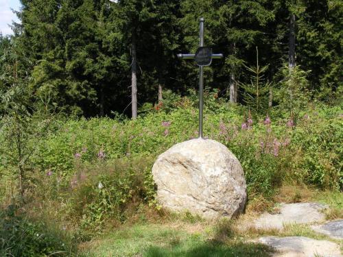a cross on top of a rock in a field at Holiday home our little hunting lodge in Philippsreut