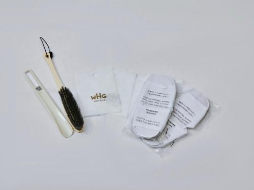 a pile of makeup items including a wand and a brush at Kansai Airport Washington Hotel in Izumi-Sano