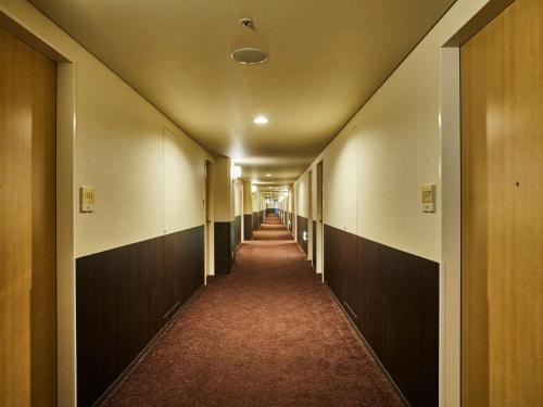a hallway of an office building with a long corridor at Kansai Airport Washington Hotel in Izumi-Sano