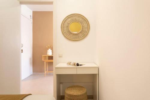 a room with a table and a mirror on the wall at Lodging Apartments Rambla Poblenou 12 in Barcelona