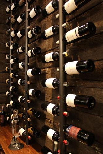 a wall of wine bottles in a wine cellar at Hotel Estelar Parque de la 93 in Bogotá