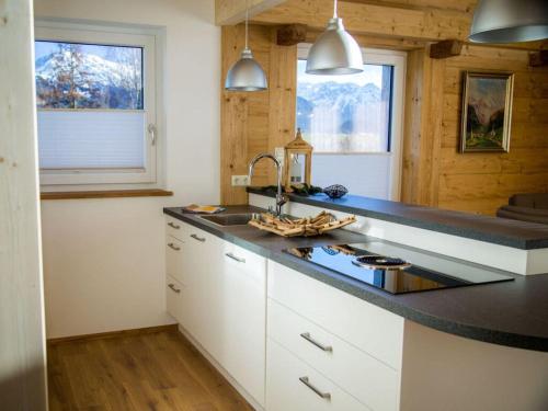 a kitchen with a sink and a counter top at Nice apartment in Bolsterlang in Bolsterlang