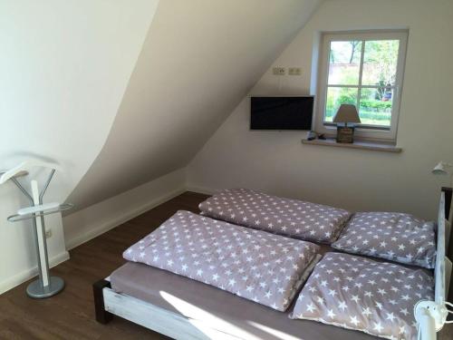 Giường trong phòng chung tại Holiday home Rügen-Dream