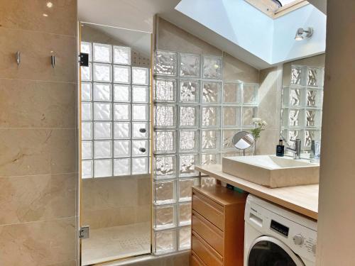 a bathroom with a shower and a sink at Ojen Penthouse in Ojén