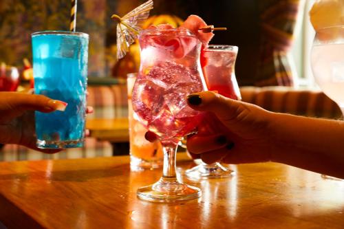 a person is holding a drink on a table at The Mayfield Seamer in Scarborough