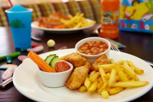 a plate of food with french fries and sauce at The Mayfield Seamer in Scarborough