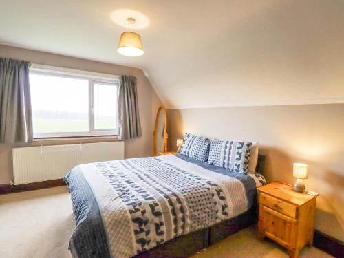 Giường trong phòng chung tại Whitestacks