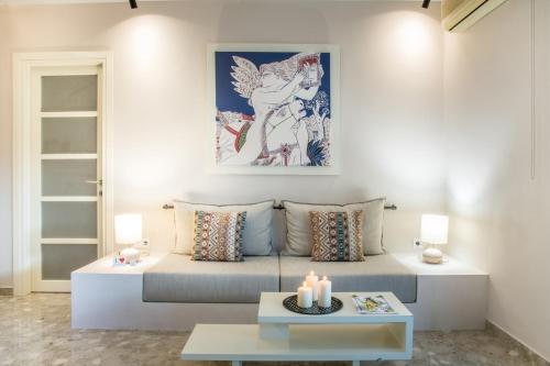 a living room with a couch and a table at Nereids Apartments in Sitia