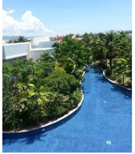 arial view of a pool with trees and blue water at Hua Hin Blue Lagoon in Cha Am