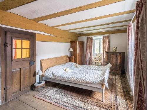 a bedroom with a bed and a wooden ceiling at Lovely apartment in Unsleben in Unsleben