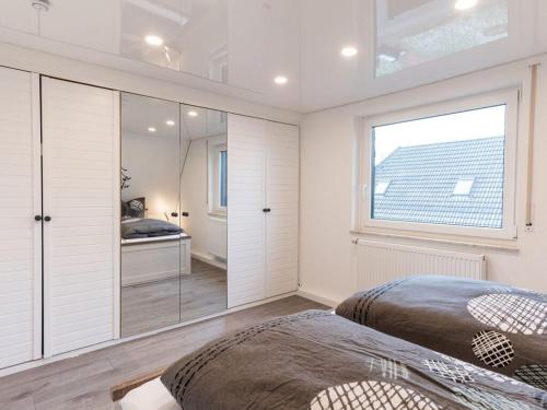 Ένα ή περισσότερα κρεβάτια σε δωμάτιο στο Maiwaldo House Comfortable Vacation Home