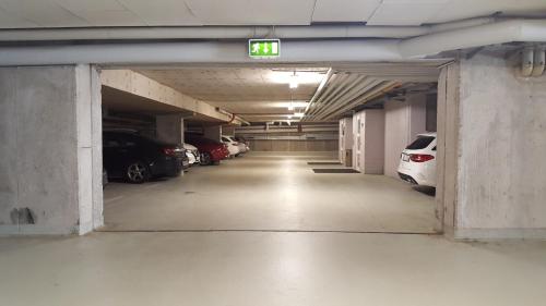 an empty parking garage with cars parked in it at Erikson Hotel in Sindelfingen