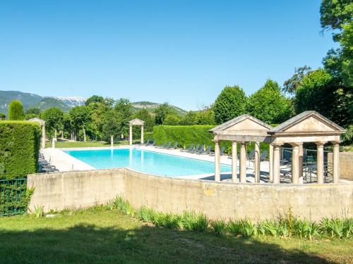 a swimming pool with a gazebo in a yard at Cozy Apartment with Swimming Pool Terrace Garden Parking in Montbrun-les-Bains