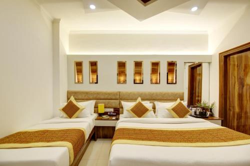 a hotel room with two beds in a room at Hotel Star Villa - Front of New Delhi Railway Station & 5 Minute from Connaught Place in New Delhi