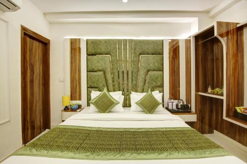 a bedroom with a large bed in a room at Hotel Star Villa - Front of New Delhi Railway Station & 5 Minute from Connaught Place in New Delhi