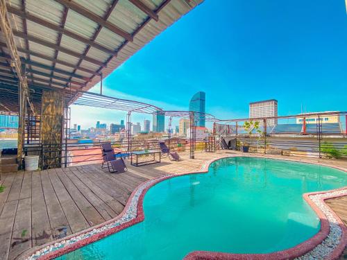 a swimming pool on the roof of a building at Le Casablanca Hotel in Phnom Penh