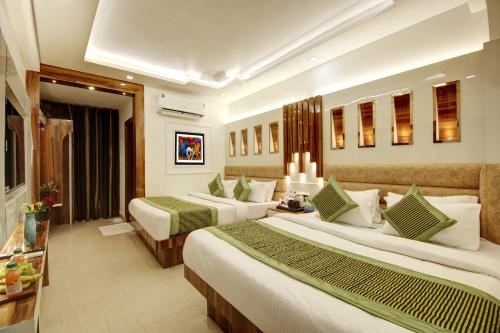 a hotel room with two beds in a room at Hotel Star Villa - Front of New Delhi Railway Station & 5 Minute from Connaught Place in New Delhi