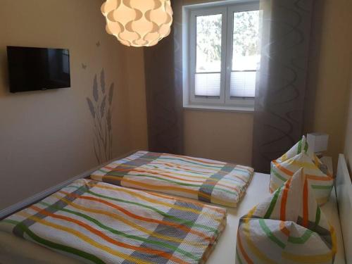 เตียงในห้องที่ Golf idyll holiday apartment