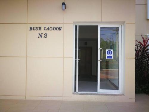 an open door to a building with a blue lagoon sign at Hua Hin Blue Lagoon in Cha Am