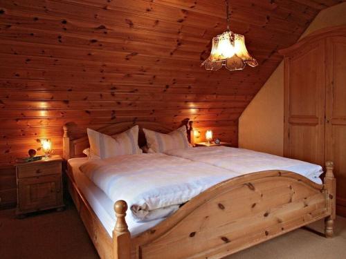 a bedroom with a large bed in a wooden ceiling at Appealing apartment in Motten in Motten